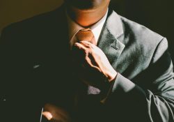 Man fixing his tie.