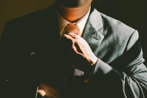 Man fixing his tie.