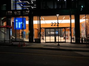 In front of a Linkedin office at night.