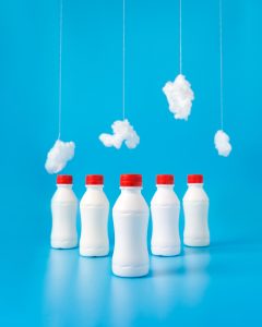 Plastic bottles, cotton with a light blue background.